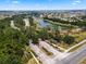 Scenic view of the community entrance, showcasing the well-maintained landscaping and waterway at 3643 Weatherfield Dr, Kissimmee, FL 34746