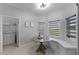 Corner dining nook with bench seating, bright windows, and access to the laundry area at 3643 Weatherfield Dr, Kissimmee, FL 34746