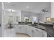 Bright kitchen with a breakfast bar, casual dining nook, and a double sink at 3643 Weatherfield Dr, Kissimmee, FL 34746