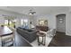 Stylish living room with neutral decor, a ceiling fan, and sliding glass doors to the backyard at 3643 Weatherfield Dr, Kissimmee, FL 34746
