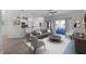 Bright and airy living room featuring stylish furniture and seamless transition to the kitchen at 3643 Weatherfield Dr, Kissimmee, FL 34746