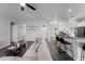 Spacious living area features a breakfast bar, stylish decor, and access to other rooms at 3643 Weatherfield Dr, Kissimmee, FL 34746