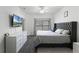 Neutral main bedroom featuring wood-look floors, modern decor, and an oversized window at 3643 Weatherfield Dr, Kissimmee, FL 34746