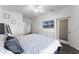 Spacious bedroom with wood-look floors, modern decor, and access to an outdoor area at 3643 Weatherfield Dr, Kissimmee, FL 34746