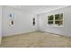 Well-lit bedroom with modern wood-look flooring and multiple windows offering plenty of natural light at 3724 Deer Ridge Dr, Mount Dora, FL 32757