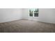 Bright bedroom features neutral carpet and a double window offering ample natural light at 3724 Deer Ridge Dr, Mount Dora, FL 32757