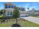 Beautiful two-story home featuring stone accents, a three-car garage and landscaped front yard at 3724 Deer Ridge Dr, Mount Dora, FL 32757