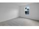 Bright and airy bedroom with neutral carpeting and a single window at 3732 Deer Ridge Dr, Mount Dora, FL 32757