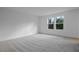 Bright bedroom with neutral carpeting and natural light from window at 3732 Deer Ridge Dr, Mount Dora, FL 32757