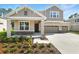 Charming two-story home with a two-car garage and a well-maintained front yard landscape at 3732 Deer Ridge Dr, Mount Dora, FL 32757