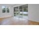 Living room with sliding glass doors leading to a backyard at 3732 Deer Ridge Dr, Mount Dora, FL 32757