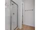 Bathroom showcasing a glass-enclosed shower with tiled walls and tile flooring at 652 Hennepin Loop, Lake Wales, FL 33898