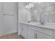Bathroom featuring double sink vanity with modern fixtures, framed mirror, and tile flooring at 652 Hennepin Loop, Lake Wales, FL 33898