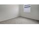 Simple bedroom with neutral carpet and a window at 652 Hennepin Loop, Lake Wales, FL 33898