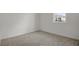 Neutral carpeted bedroom with a window at 652 Hennepin Loop, Lake Wales, FL 33898