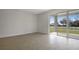 Open living space with large sliding glass doors leading to the outside at 652 Hennepin Loop, Lake Wales, FL 33898