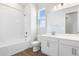 Well-lit bathroom with tiled shower, vanity, and modern fixtures at 656 Hennepin Loop, Lake Wales, FL 33898