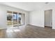 Bright open living area with tile floors and large glass sliding doors to the exterior at 656 Hennepin Loop, Lake Wales, FL 33898