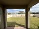 View of the backyard with green grass and white fence at 1222 Castlevecchio Loop, Orlando, FL 32825
