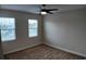Bright bedroom with carpet, ceiling fan and two windows with views at 1222 Castlevecchio Loop, Orlando, FL 32825