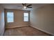 Bedroom features two windows for ample natural light and a ceiling fan at 1222 Castlevecchio Loop, Orlando, FL 32825