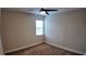 Carpeted bedroom with ceiling fan and one window allowing natural light at 1222 Castlevecchio Loop, Orlando, FL 32825