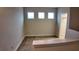 Bright bonus room with three windows allowing for natural light and neutral carpeting at 1222 Castlevecchio Loop, Orlando, FL 32825