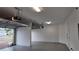Spacious two-car garage with concrete block walls, overhead lights, and two garage door openers at 1222 Castlevecchio Loop, Orlando, FL 32825