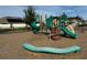 A neighborhood playground featuring slides, climbing structures, and green and brown earth tone colors at 1222 Castlevecchio Loop, Orlando, FL 32825