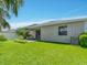 View of the home's backyard and covered patio at 1569 Thetford Cir, Orlando, FL 32824