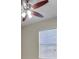 Neutral bedroom featuring wood floors, a ceiling fan, and a window at 1569 Thetford Cir, Orlando, FL 32824