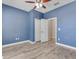 Cozy bedroom featuring new laminate floors, a ceiling fan, and a double door closet at 1569 Thetford Cir, Orlando, FL 32824