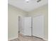 Neutral bedroom featuring wood floors, lots of storage, and great natural light at 1569 Thetford Cir, Orlando, FL 32824