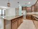 Kitchen with stainless steel appliances, dark cabinets, granite countertops, and a center island with sink at 1569 Thetford Cir, Orlando, FL 32824
