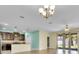 Open-concept living area with stainless-steel appliances, ample natural light, and a view to the kitchen at 1569 Thetford Cir, Orlando, FL 32824