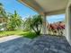 Relaxing patio with mature tropical plants at 1569 Thetford Cir, Orlando, FL 32824