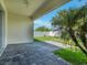 Covered patio with view of the manicured backyard at 1569 Thetford Cir, Orlando, FL 32824