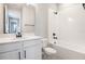 Well-lit bathroom featuring white cabinets, modern fixtures, and a shower-tub combination at 3824 Deer Ridge Dr, Mount Dora, FL 32757