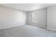 Bedroom with neutral carpet and a window bringing natural light into the space at 3824 Deer Ridge Dr, Mount Dora, FL 32757
