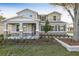 Charming two-story home featuring stone accents, a covered porch, and beautifully landscaped front yard at 3824 Deer Ridge Dr, Mount Dora, FL 32757