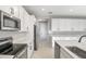 Open kitchen featuring stainless steel appliances, quartz counters, and lots of counter space at 3824 Deer Ridge Dr, Mount Dora, FL 32757