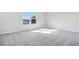 Spacious bedroom featuring grey carpet and sunlight streaming through windows at 520 Summit River Dr, Apopka, FL 32712