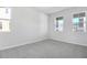 Spacious bedroom with grey carpet and multiple windows at 520 Summit River Dr, Apopka, FL 32712