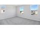 Well-lit bedroom with grey carpet and multiple windows at 520 Summit River Dr, Apopka, FL 32712