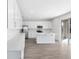 Open concept kitchen with island and white cabinets at 520 Summit River Dr, Apopka, FL 32712