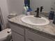 Clean bathroom with granite countertop and modern vanity at 609 Bernard Ln, Davenport, FL 33837