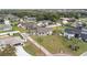 Charming single-story home featuring a well-manicured front lawn with mature palm trees and a classic driveway at 1855 Cavalier Ct, Kissimmee, FL 34744