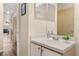 Bathroom featuring a white vanity, decorative mirror, and tiled flooring at 3151 Britannia Blvd # C, Kissimmee, FL 34747
