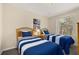 Shared bedroom featuring two twin beds, window, and decor at 3151 Britannia Blvd # C, Kissimmee, FL 34747