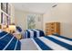 Well lit bedroom with two twin beds and dresser at 3151 Britannia Blvd # C, Kissimmee, FL 34747